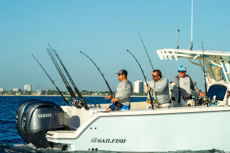 Slide: The Image of 2026 Sailfish 312 CC boat with anglers fishing offshore, featuring Yamaha engines. - 4