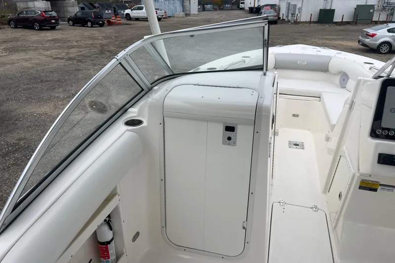 Slide: The Image of 2022 Key West 239 DFS boat interior with seating and control panel. - 14