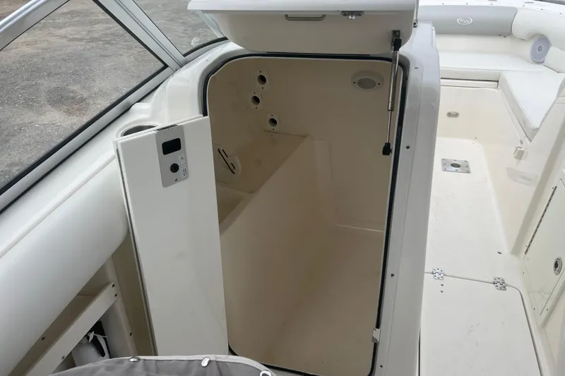 Slide: The Image of 2022 Key West 239 DFS boat interior with open storage compartment. - 15