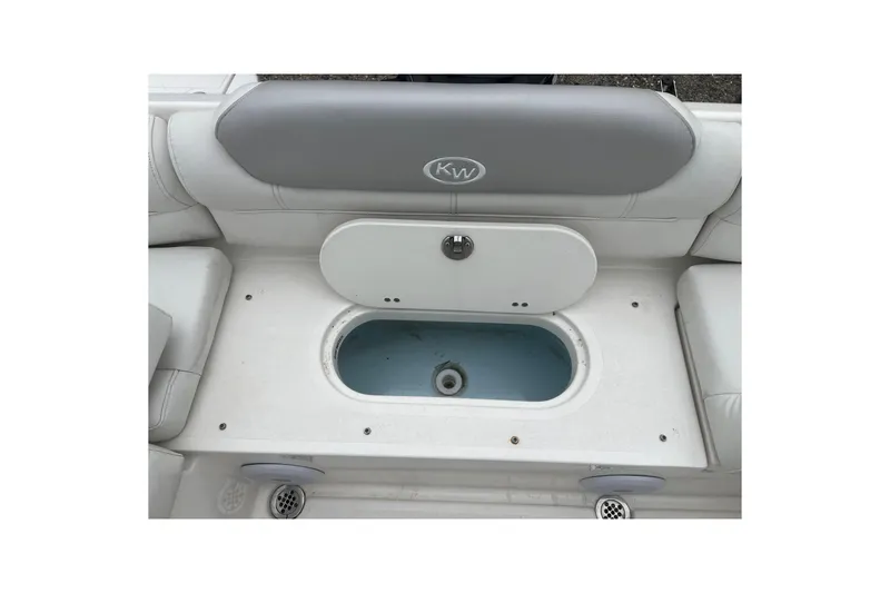 Slide: The Image of 2022 Key West 239 DFS boat seating with storage compartment open. - 21