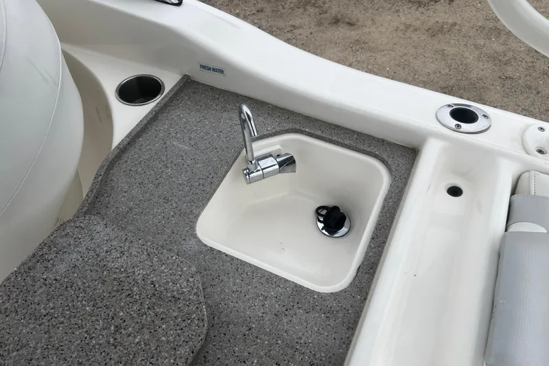 Slide: The Image of Key West 239 DFS 2022 boat interior with sink and faucet detail. - 22