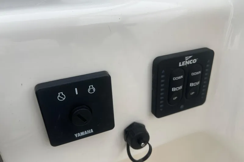 Slide: The Image of Control panel of a 2022 Key West 239 DFS boat with Yamaha and Lenco switches. - 24