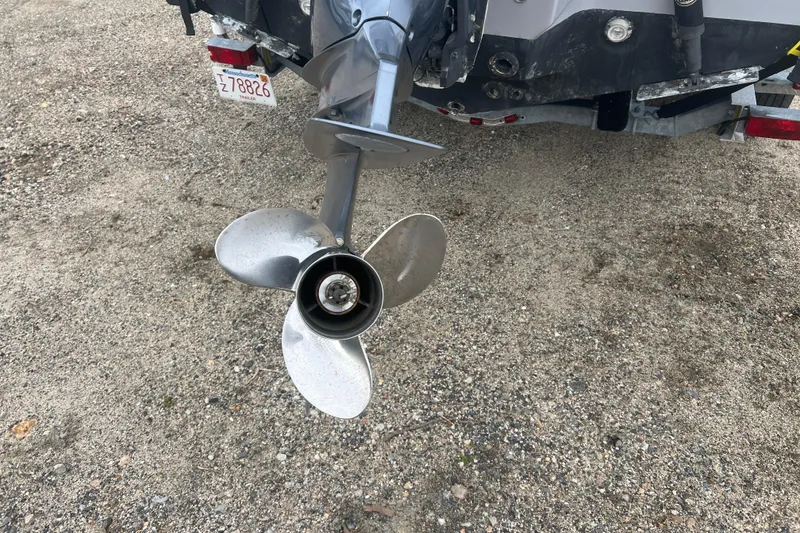 Slide: The Image of Propeller of a 2022 Key West 239 DFS boat on gravel surface. - 26