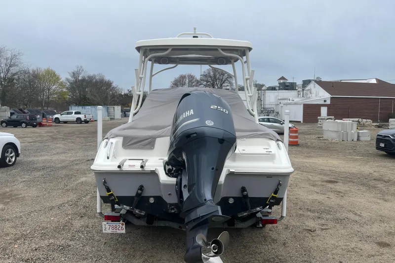Slide: The Image of 2022 Key West 239 DFS boat with Yamaha 250 engine, parked outdoors. - 29