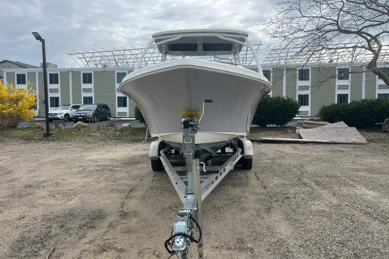 Slide: The Image of 2022 Key West 239 DFS boat on trailer, parked outdoors near buildings. - 3