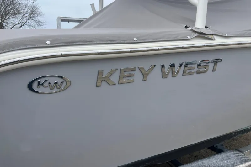 Slide: The Image of 2022 Key West 239 DFS boat with logo and cover, side view. - 31