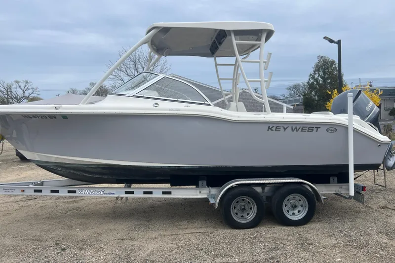 Slide: The Image of 2022 Key West 239 DFS boat on trailer, side view, outdoors. - 5