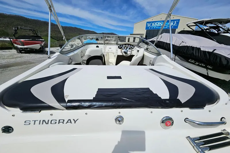 Slide: The Image of 2015 Stingray 180 RX boat interior at Norris Lake, showcasing sleek design and seating. - 9