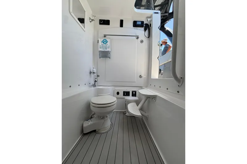 Slide: The Image of Interior of 2021 Midnight Express 37 Open boat bathroom with modern fixtures. - 10