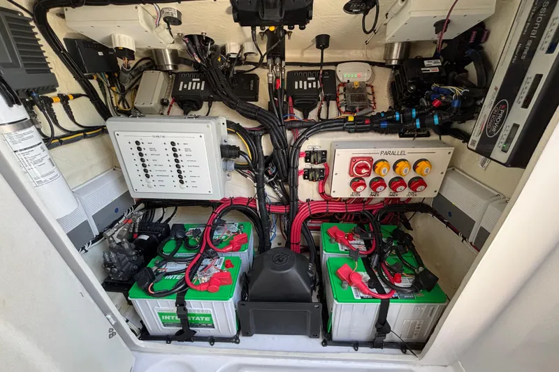 Slide: The Image of Electrical system of a 2021 Midnight Express 37 Open boat, featuring batteries and wiring. - 11