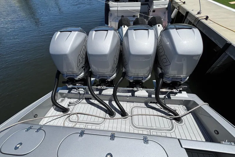 Slide: The Image of Four powerful outboard engines on a 2021 Midnight Express 37 Open boat. - 12