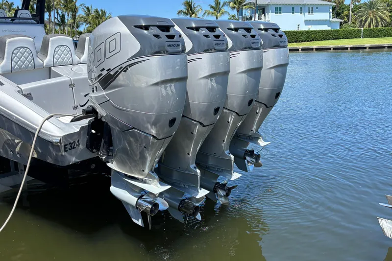 Slide: The Image of Four powerful Mercury outboard engines on a 2021 Midnight Express 37 Open boat. - 13