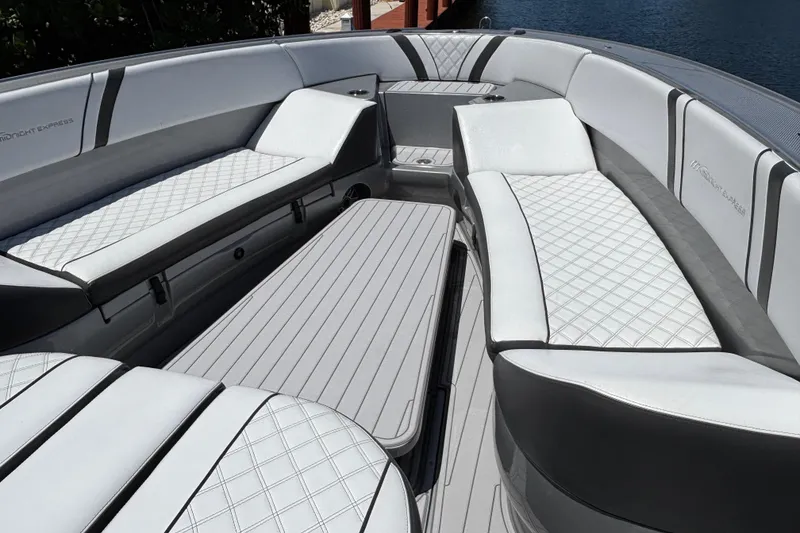 Slide: The Image of Luxurious seating on 2021 Midnight Express 37 Open boat, featuring elegant quilted upholstery. - 4