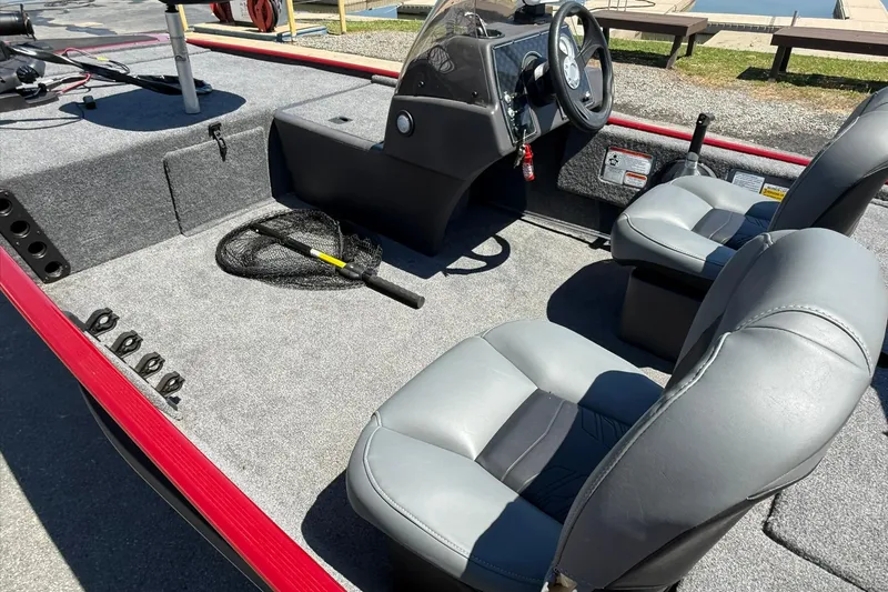 Slide: The Image of 2020 Tracker Bass Tracker Classic XL boat interior with seats and fishing gear. - 12