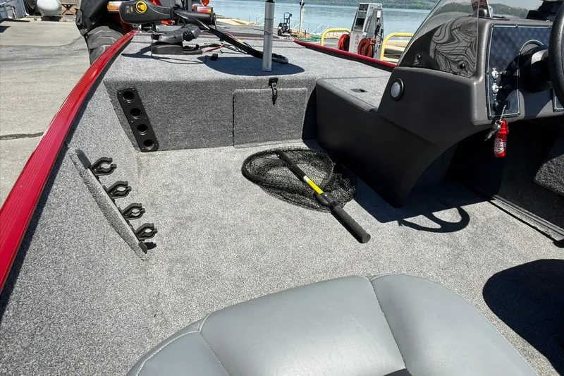 Slide: The Image of 2020 Tracker Bass Tracker Classic XL boat interior with fishing gear and controls. - 13