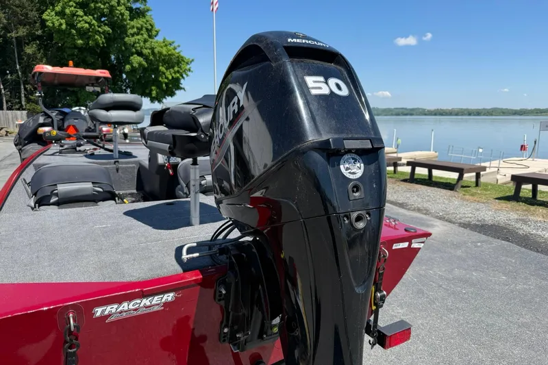 Slide: The Image of 2020 Tracker Bass Tracker Classic XL boat with Mercury 50 engine by a lake. - 2