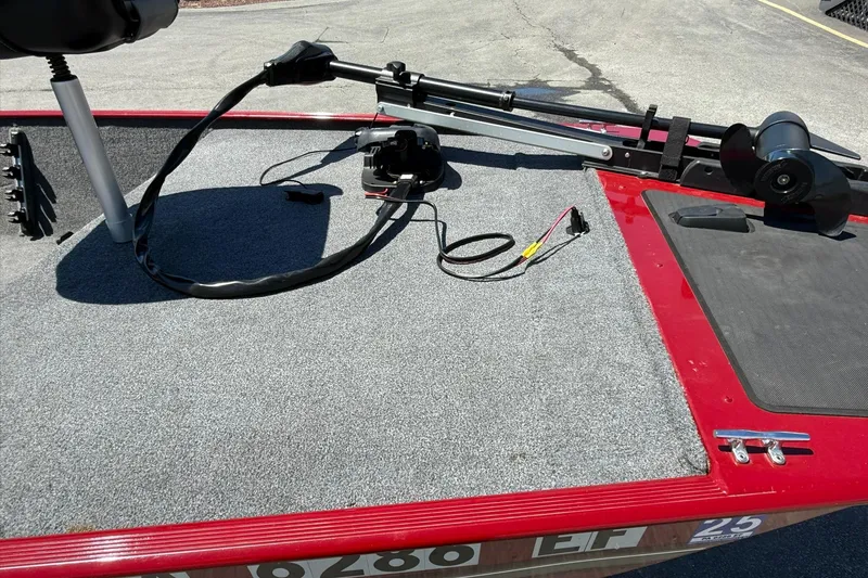 Slide: The Image of 2020 Tracker Bass Tracker Classic XL boat deck with trolling motor and carpeted surface. - 6