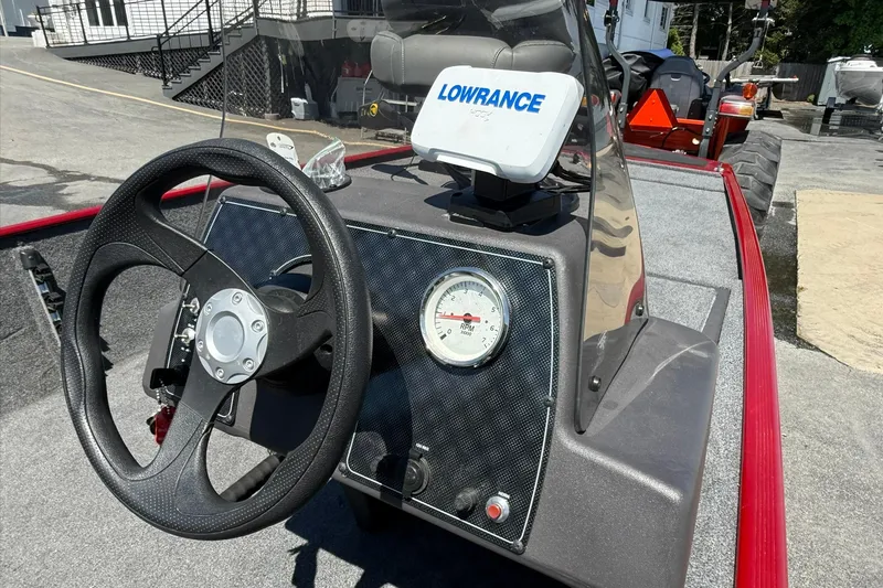 Slide: The Image of 2020 Tracker Bass Tracker Classic XL dashboard with steering wheel and Lowrance GPS. - 8