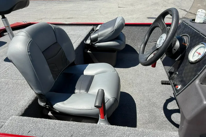 Slide: The Image of 2020 Tracker Bass Tracker Classic XL boat interior with steering wheel and seats. - 9