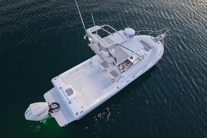 Slide: The Image of 1985 Chris-Craft 21 Scorpion Cuddy boat on calm water, aerial view. - 15