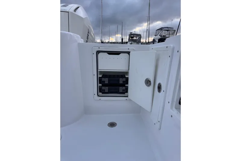 Slide: The Image of 1985 Chris-Craft 21 Scorpion Cuddy boat interior with open storage compartment. - 32