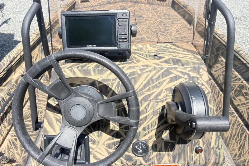 Slide: The Image of 2022 Lowe Roughneck 1860CC boat console with steering wheel and Garmin GPS. - 6