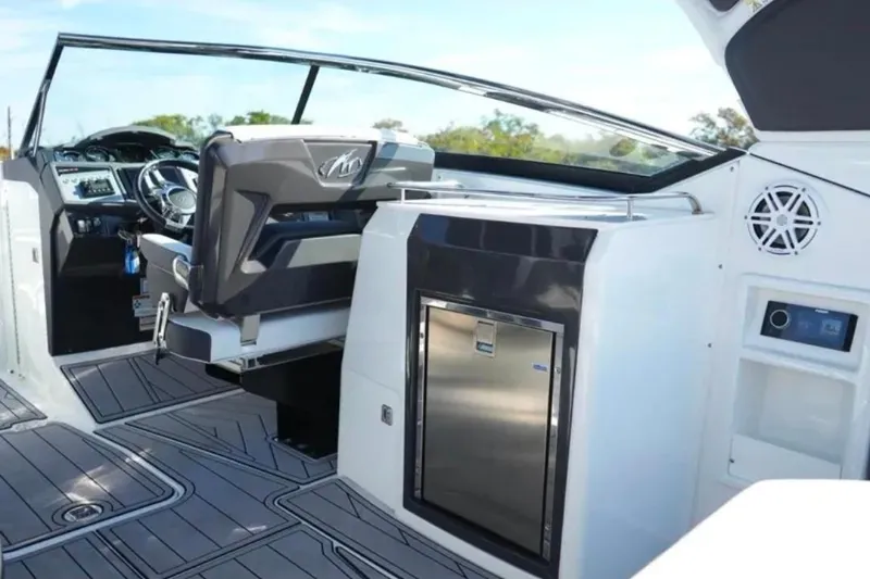 Slide: The Image of 2022 Monterey 305SS Super Sport boat interior with sleek design and modern amenities. - 8