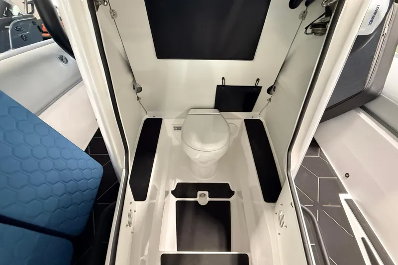 Slide: The Image of Interior of 2026 Highfield ADV7 boat featuring a compact, modern bathroom design. - 24