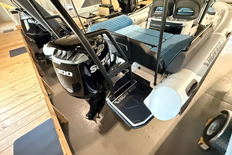 Slide: The Image of 2026 Highfield ADV7 boat with Suzuki 300 engine, featuring blue seating and sleek design. - 28