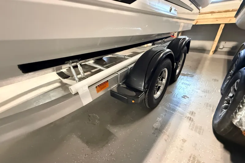 Slide: The Image of 2026 Highfield ADV7 boat trailer with dual wheels in a garage setting. - 31