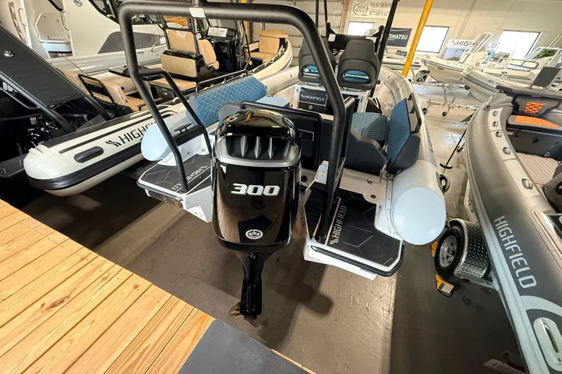 Slide: The Image of 2026 Highfield ADV7 boat with 300 horsepower engine in showroom display. - 4