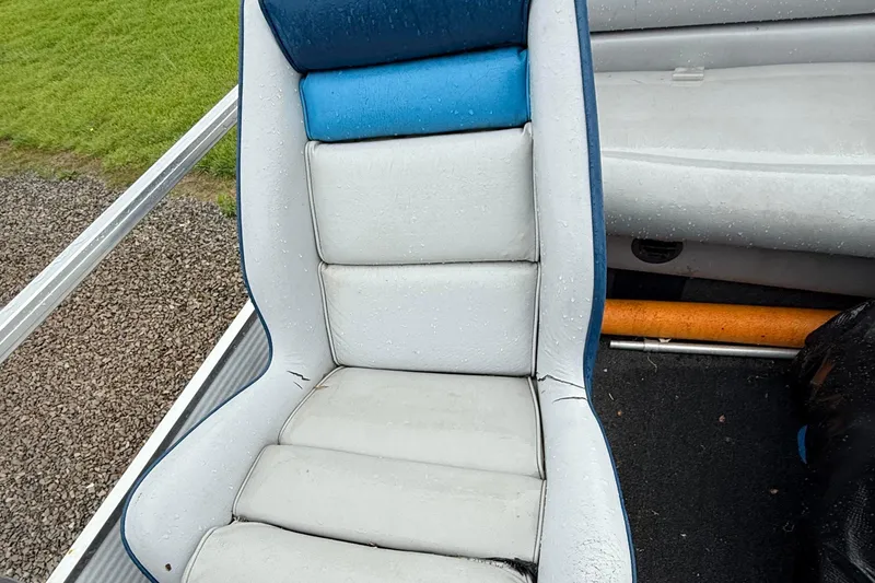 Slide: The Image of Wet seat on 1989 Godfrey Aqua Patio 2424 boat, with blue and white upholstery. - 8