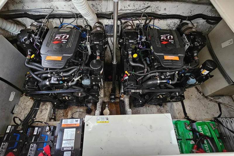 Slide: The Image of Twin MerCruiser engines in a 2004 Rinker Fiesta Vee 312 boat engine compartment. - 28