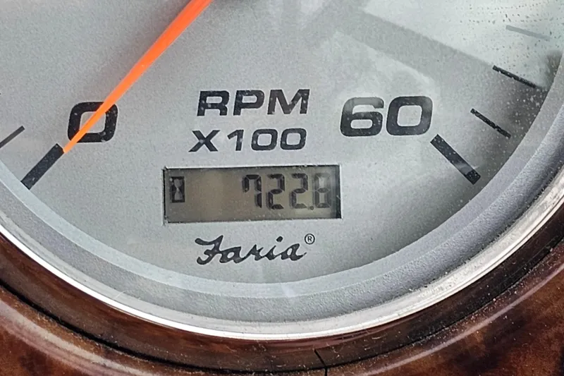 Slide: The Image of Close-up of a Faria RPM gauge reading 722.8 on a 2004 Rinker Fiesta Vee 312. - 31