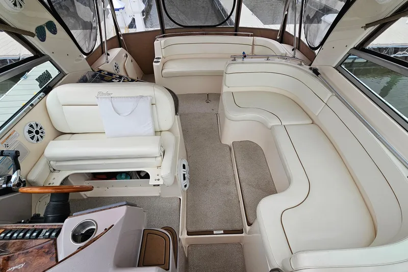 Slide: The Image of 2004 Rinker Fiesta Vee 312 boat interior with spacious seating and elegant design. - 6