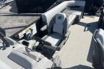 Slide: The Image of 2026 Princecraft Vectra 23 L boat interior with gray seating and steering console. - 10