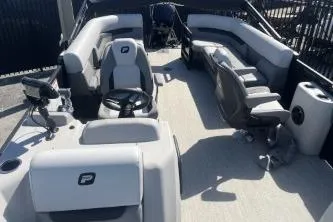 Slide: The Image of 2026 Princecraft Vectra 23 L pontoon boat interior with plush seating and modern helm. - 8