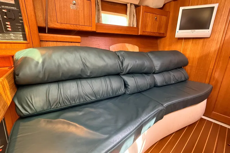 Slide: The Image of Luxurious interior of 2002 Hunter 386 yacht with leather seating and wooden cabinetry. - 10