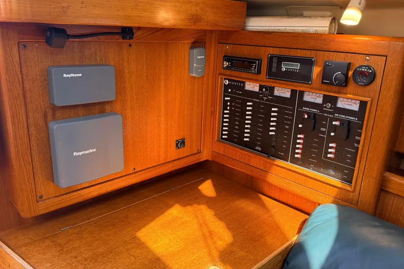 Slide: The Image of Control panel of a 2002 Hunter 386 sailboat with Raytheon equipment. - 12