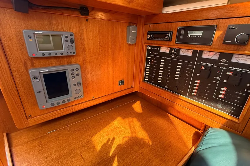 Slide: The Image of Control panel of a 2002 Hunter 386 sailboat with navigation instruments. - 14
