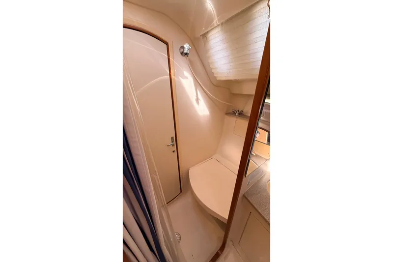 Slide: The Image of Compact bathroom interior of 2002 Hunter 386 yacht with shower and sink. - 23