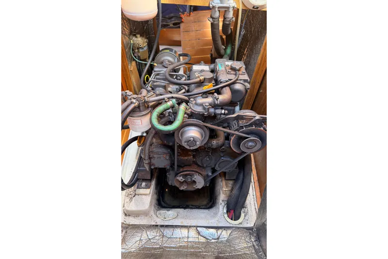 Slide: The Image of Engine compartment of a 2002 Hunter 386 sailboat, showing detailed mechanical components. - 29