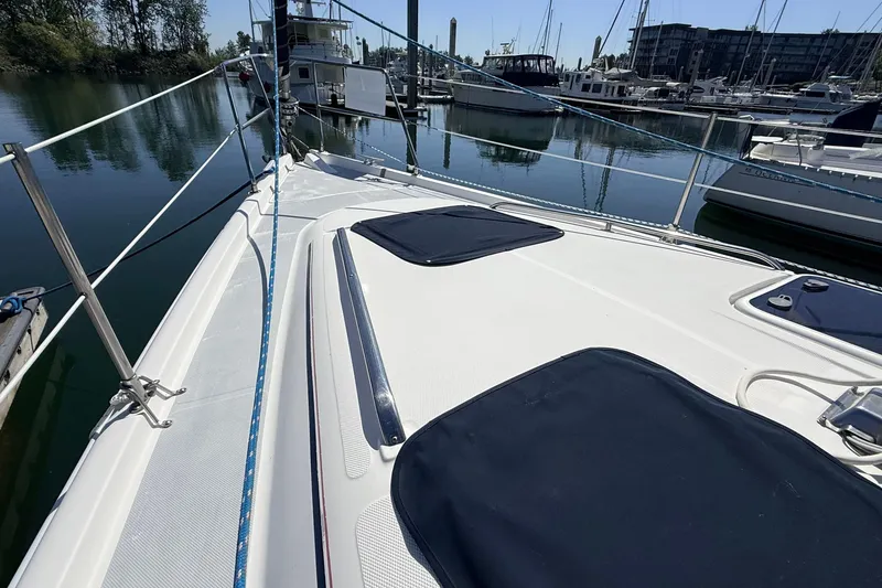 Slide: The Image of Sailboat deck of 2002 Hunter 386 model docked at marina. - 34