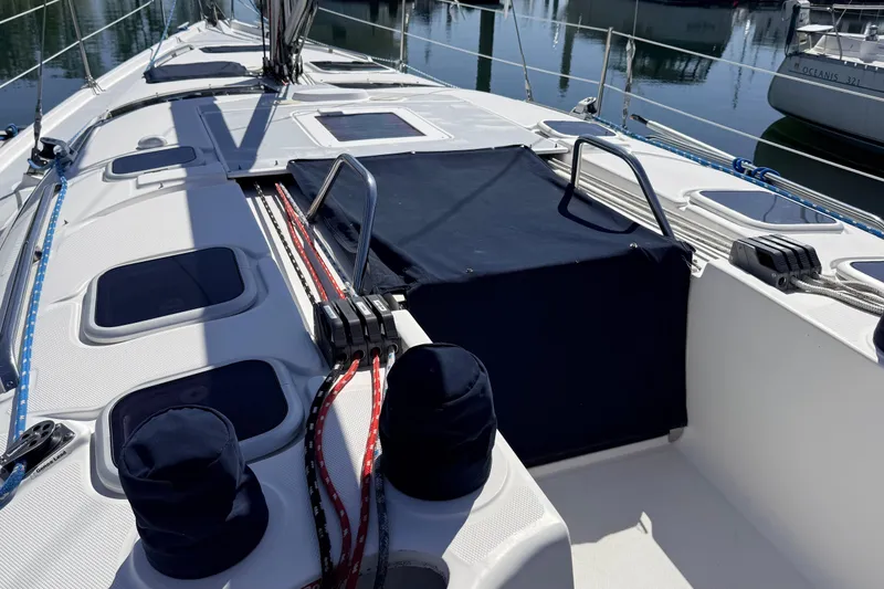 Slide: The Image of Deck of a 2002 Hunter 386 sailboat with ropes and hatches. - 37