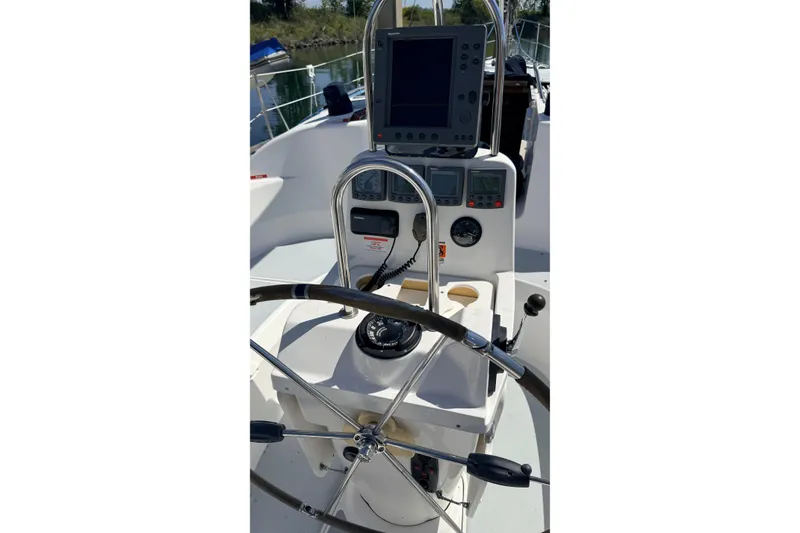 Slide: The Image of Steering console of a 2002 Hunter 386 sailboat with navigation equipment. - 43