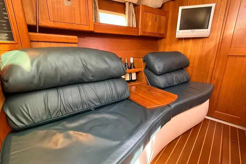 Slide: The Image of Luxurious interior of 2002 Hunter 386 yacht with leather seating and wooden accents. - 8