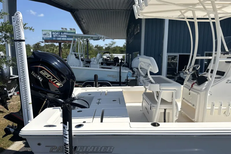 Slide: The Image of 2023 Pathfinder 2200 TRS boat with Yamaha engine at dealership. - 14