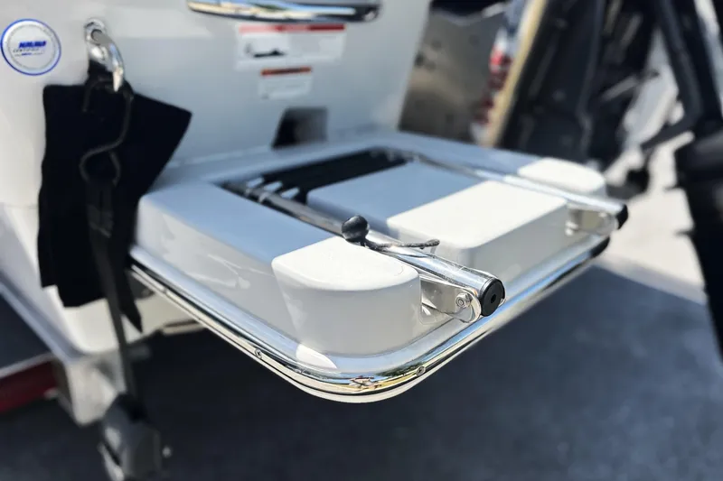 Slide: The Image of 2023 Pathfinder 2200 TRS boat ladder detail with chrome finish and safety features. - 21