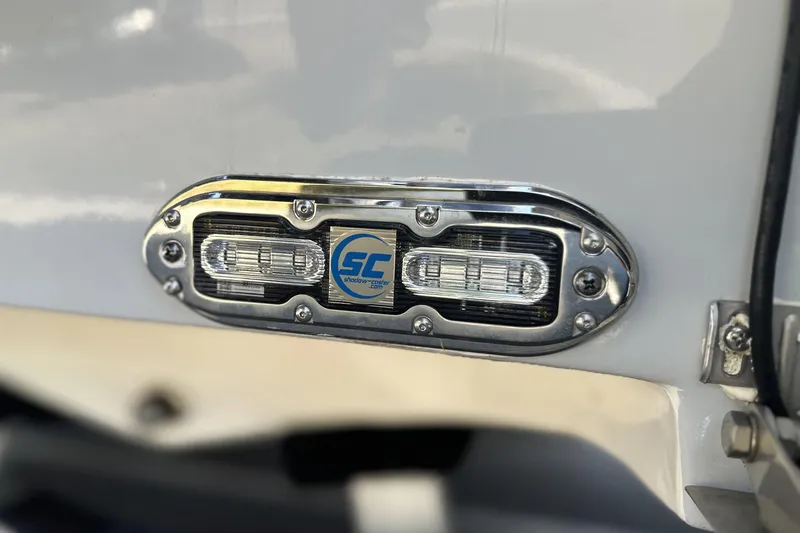 Slide: The Image of Close-up of 2023 Pathfinder 2200 TRS boat light fixture with chrome detailing. - 24