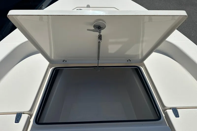 Slide: The Image of Open storage compartment on 2023 Pathfinder 2200 TRS boat, showcasing interior space. - 5